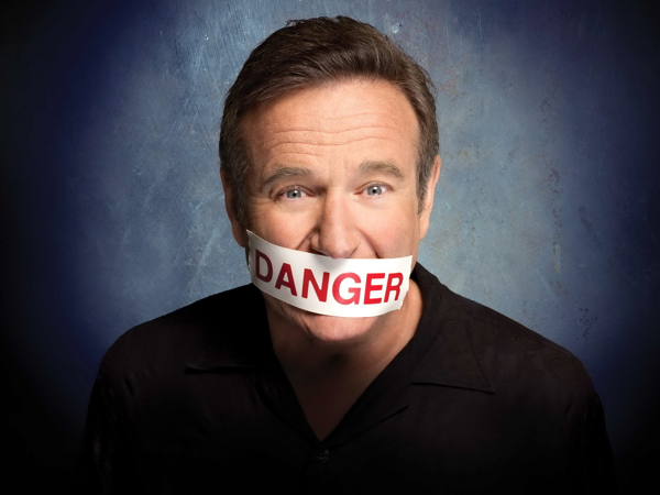 robbin williams with written danger on his mouth